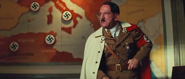 Hilter is presented as a historical figure in Inglourious Basterds.  He is used in this film as a way to hold a historical event as well as tell a story that an audience can connect to.  